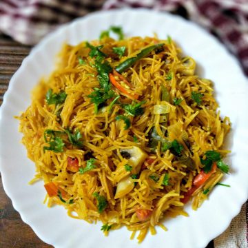 vermicelli upma in a white plate