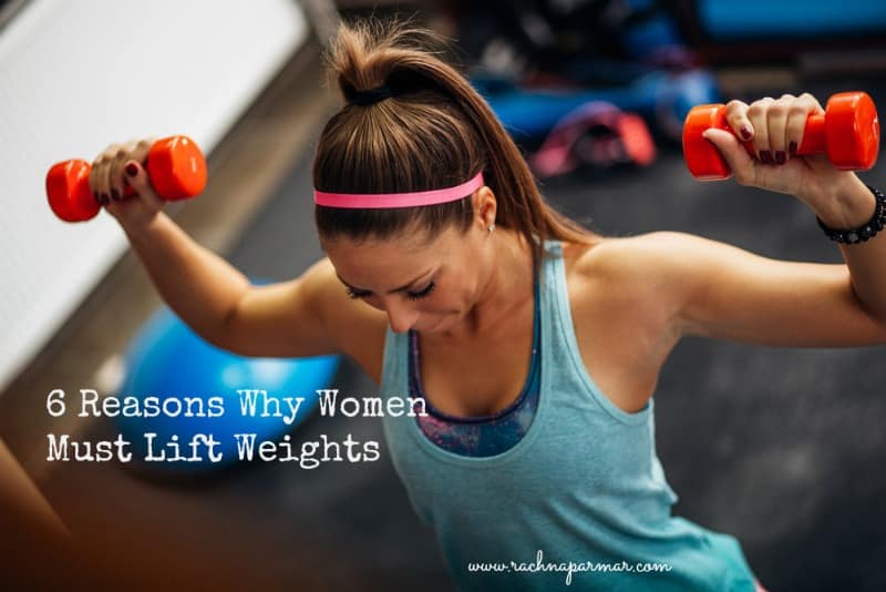 women lift weights