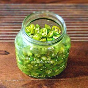 Pickled jalapenos in a glass bottle