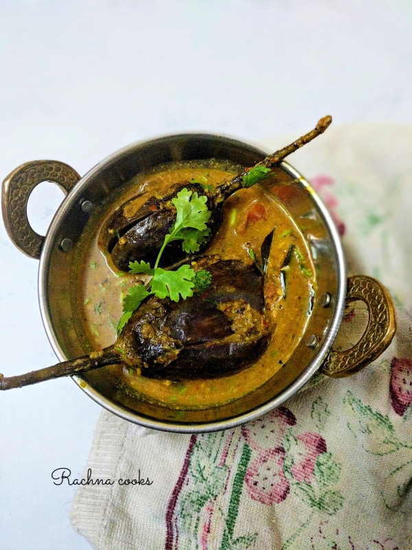 Two small aubergines served with curry in a small wok