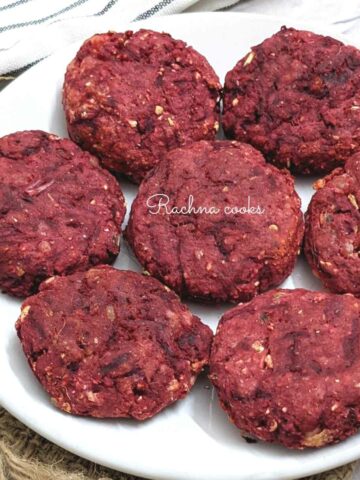 7 beetroot tikkis or cutlets on a white plate