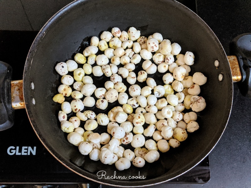 Makhana being roasted in a pan