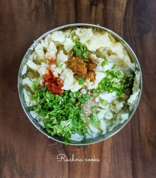 mashed potatoes with chopped herbs and spices