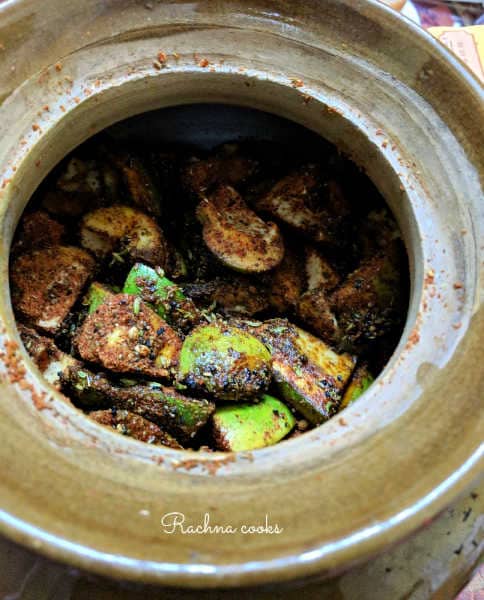 mustard oil added to raw mango pieces coated with spices.