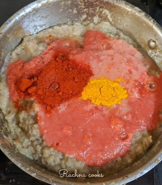 To the onion ginger garlic paste, tomato paste along with turmeric powder and cayenne added.
