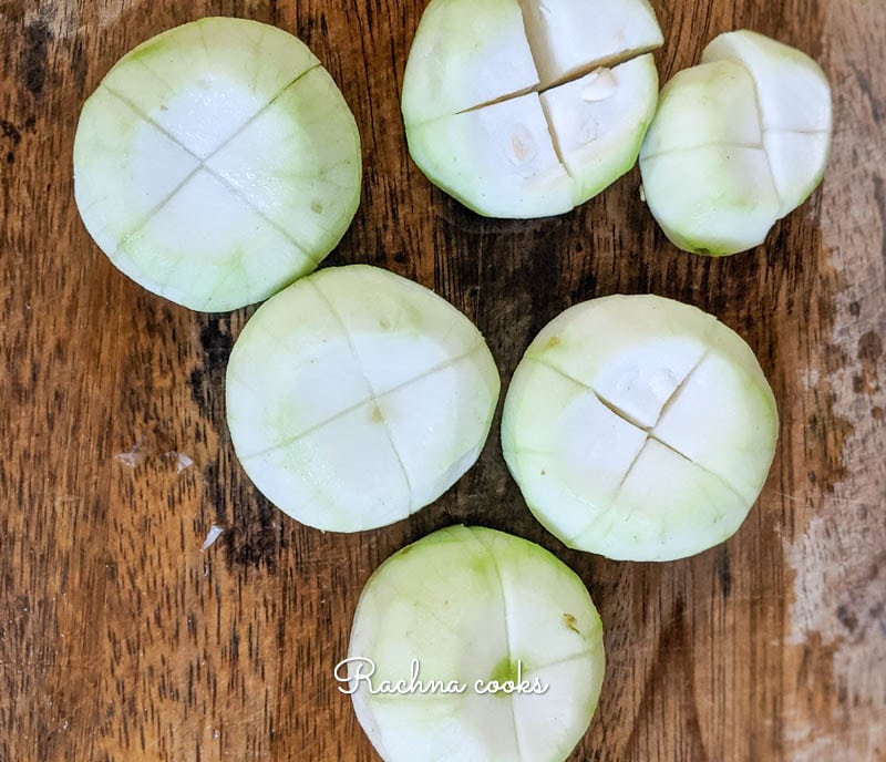 Peeled apple gourds with cross like cuts on them.