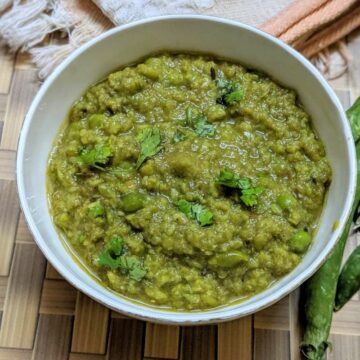 green peas curry in a white bowl