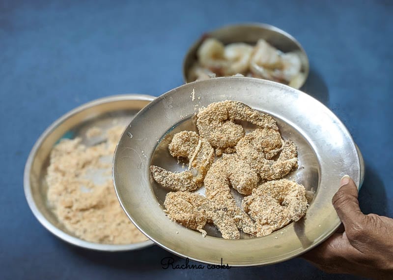 Prepare the shrimp by dipping in egg and breading for air frying.