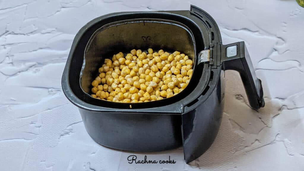 chickpeas in air fryer after 6 minutes of air frying