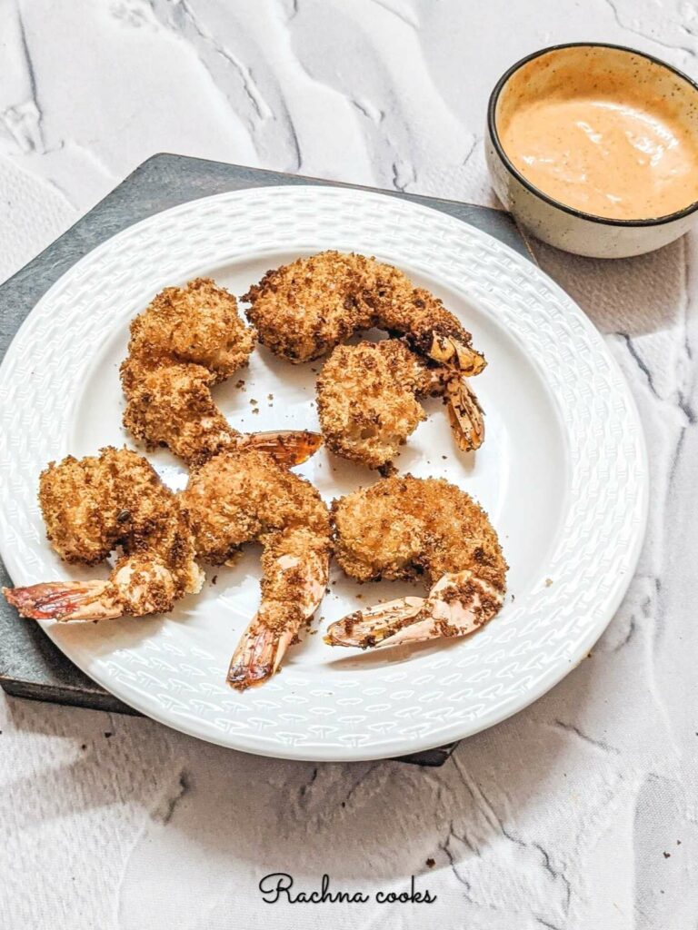 Air fried tempura shrimp on a white plate with a serve of spicy mayo