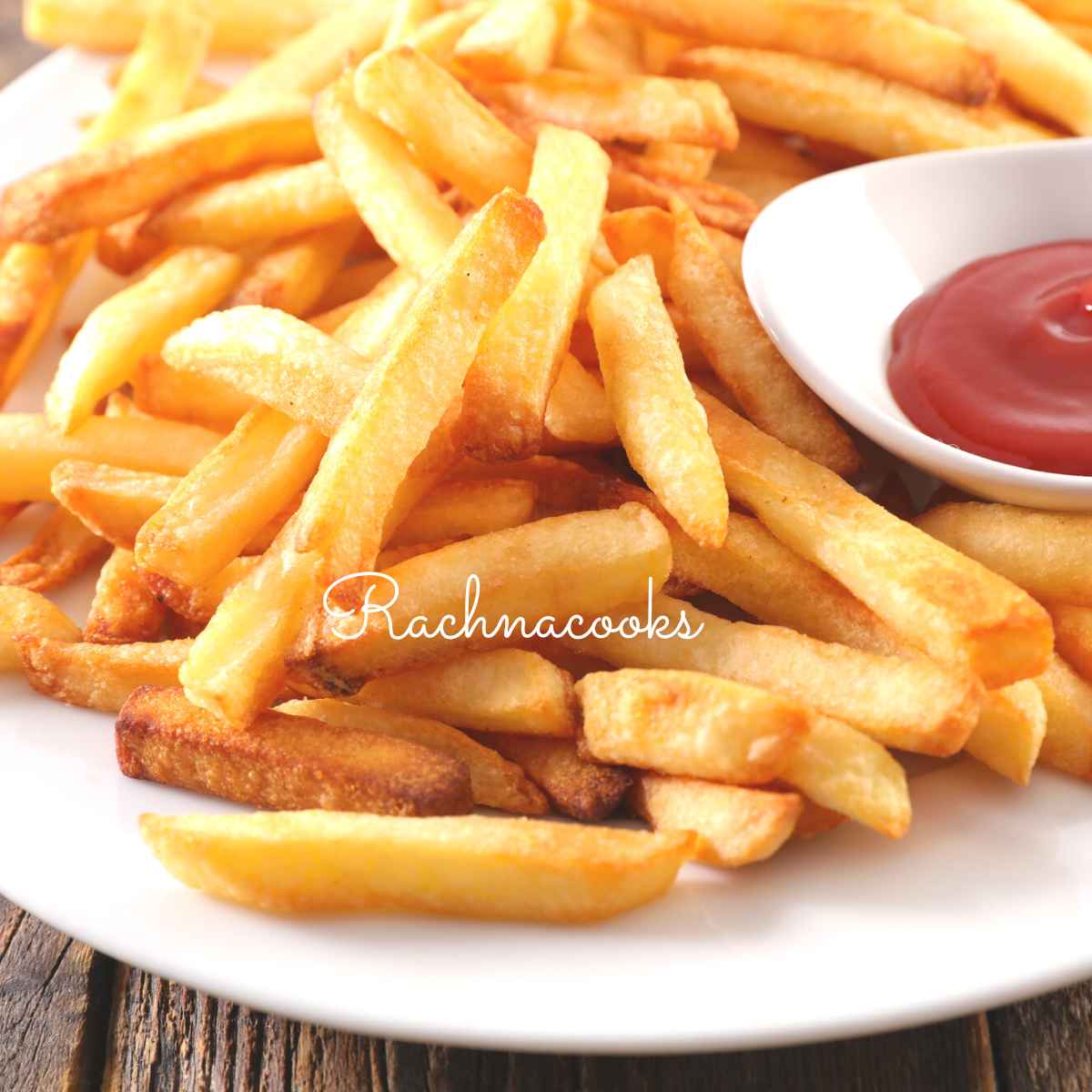A plate full of air fried fries served with ketchup