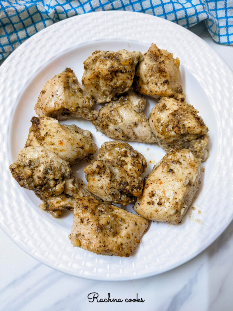 Crispy air fried lemon pepper chicken in a white plate.