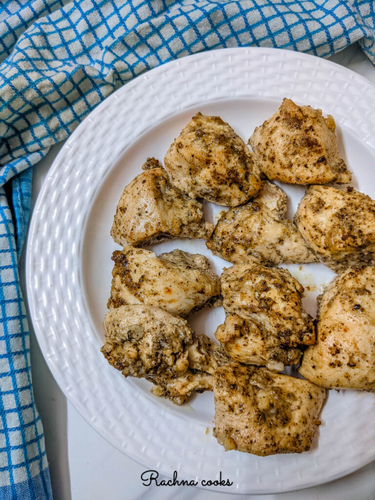 Crispy air fried lemon pepper chicken in a white plate.