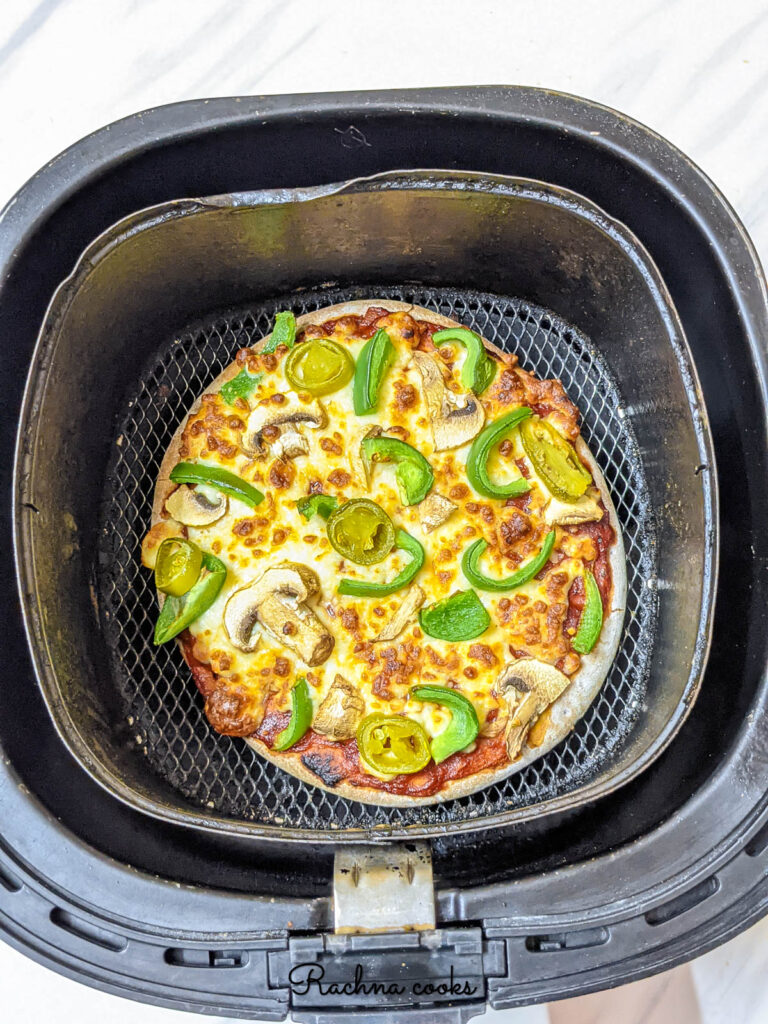 Delicious golden crispy pizza done in air fryer.