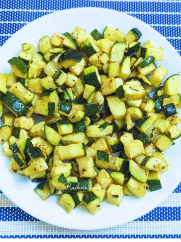 Delicious roasted zucchini in a white plate