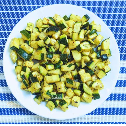 Delicious roasted zucchini in a white plate