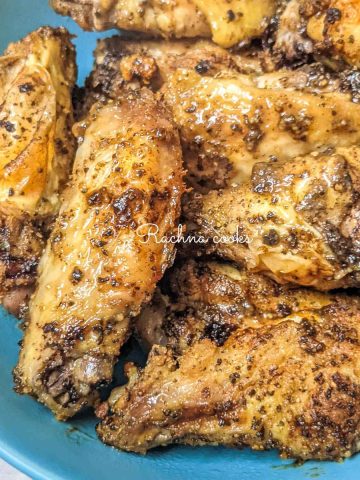 Close up of lemon pepper wings in a blue bowl