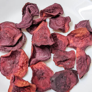 Air fryer beet chips on a white plate