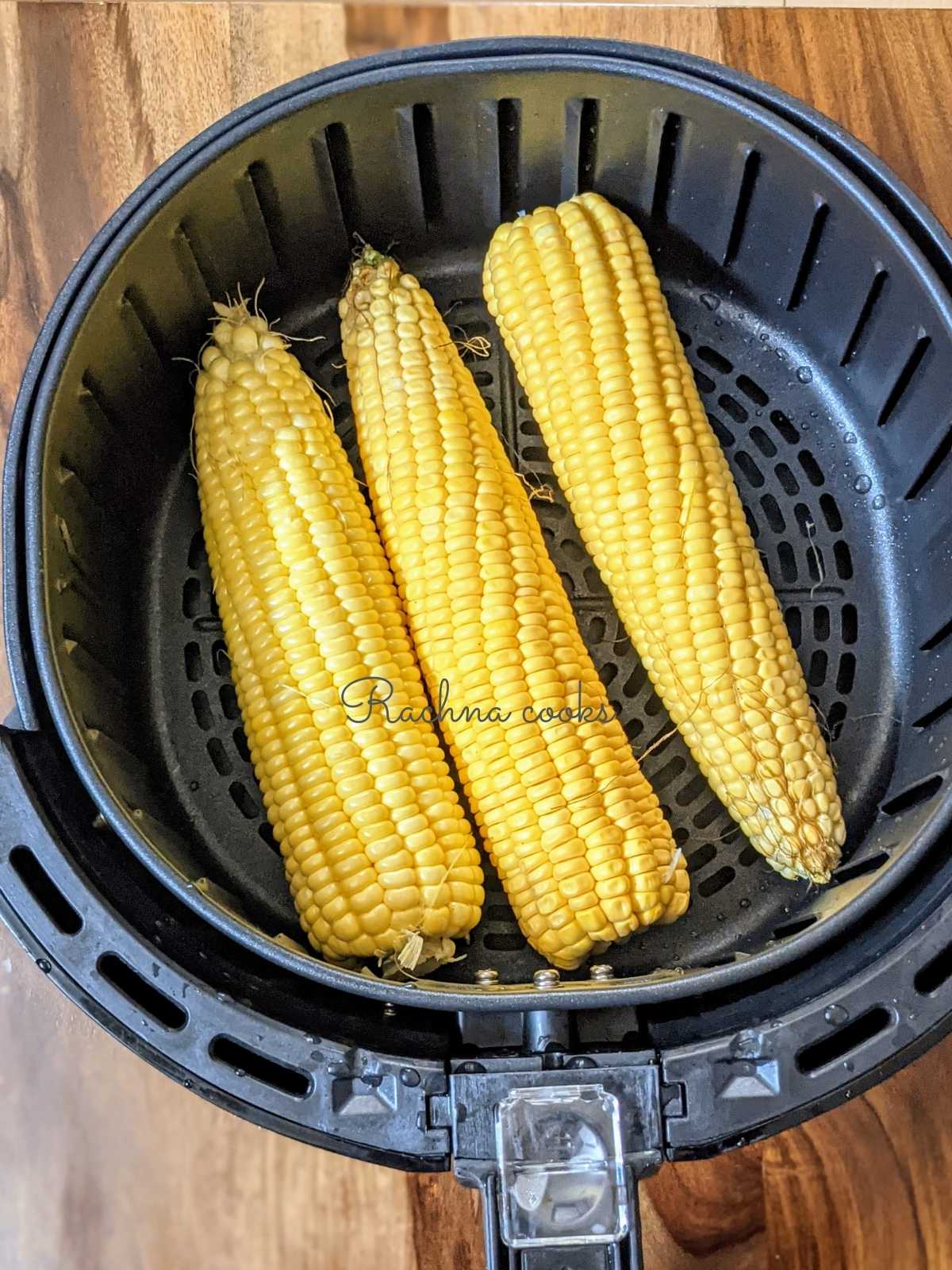 corn placed in air fryer basket