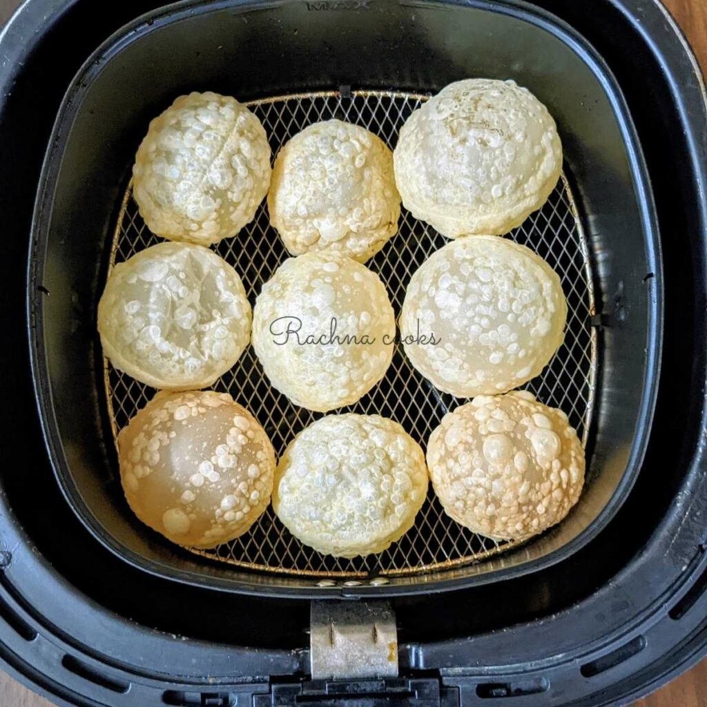 puffed puris in air fryer after air frying.