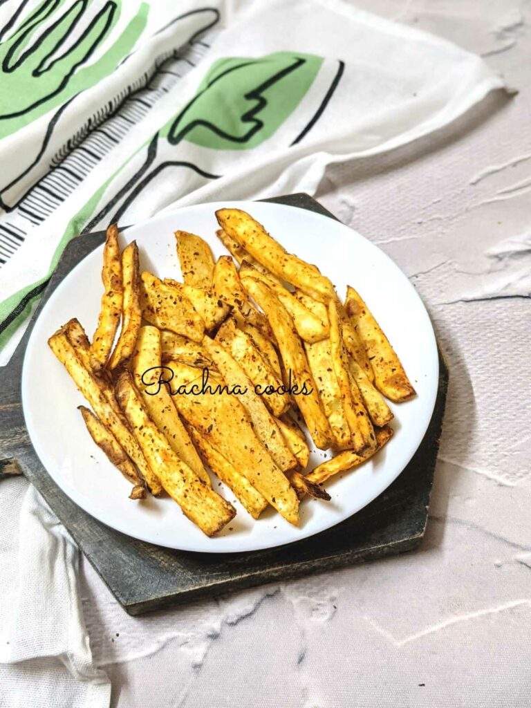 Crispy air fryer sweet potato fries on a white plate.