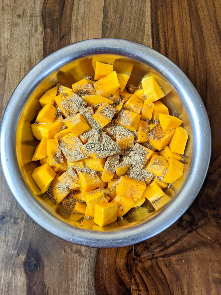 butternut squash cubes with seasonings and oil