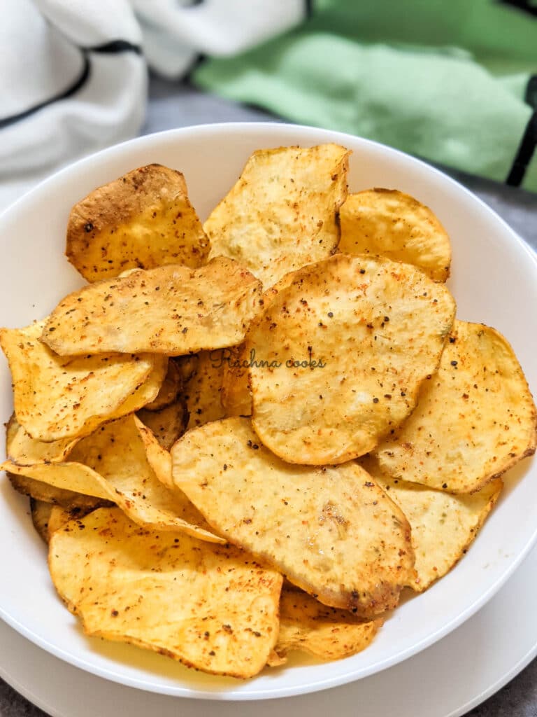 Crispy air fried sweet potato chips in a white bowl