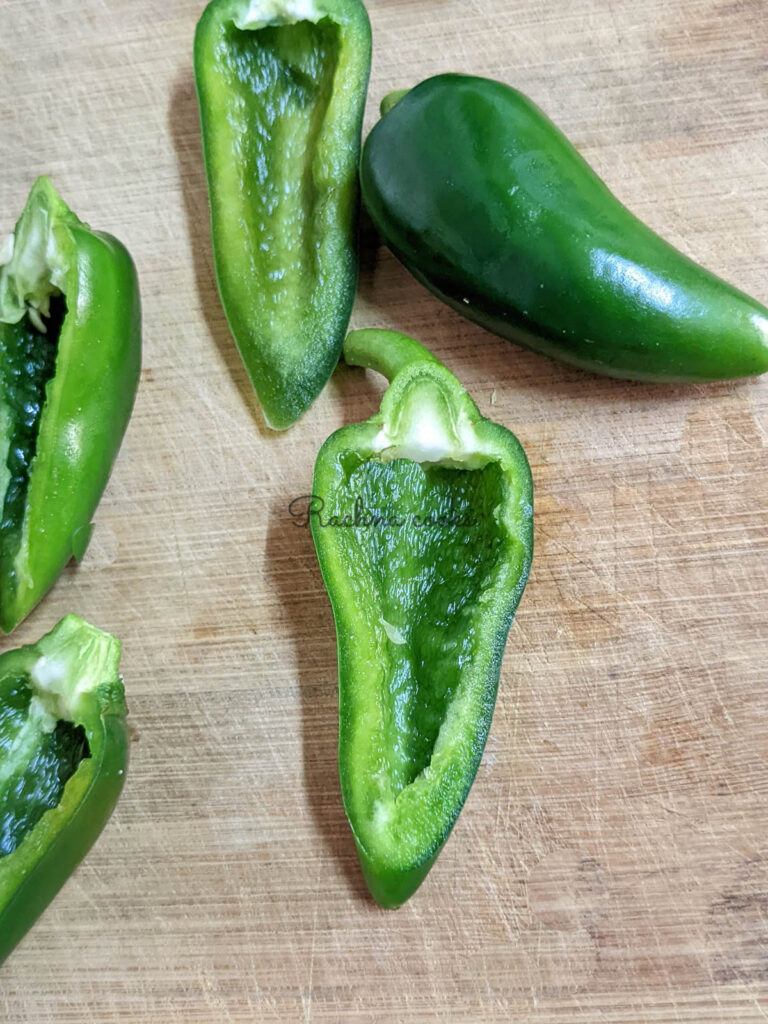 Jalapenos cut into halves with seeds and veins removed