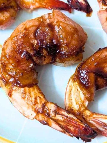 Bacon wrapped shrimp on a plate