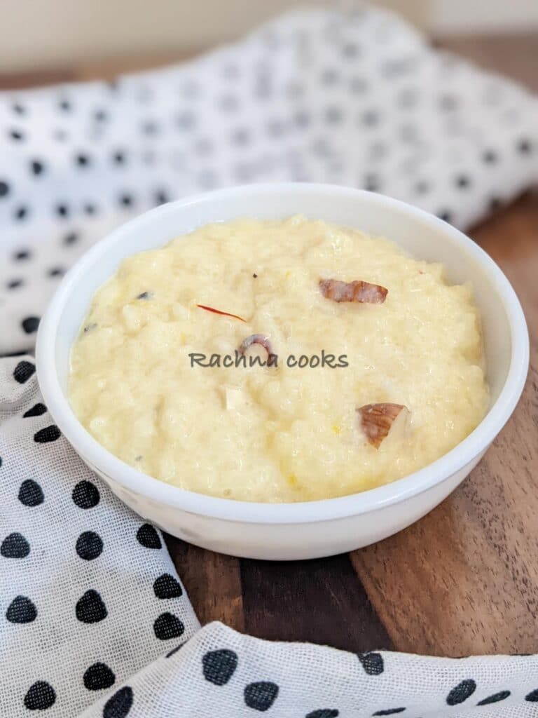 A bowl of rich kheer with slivers of almonds and saffron strands.