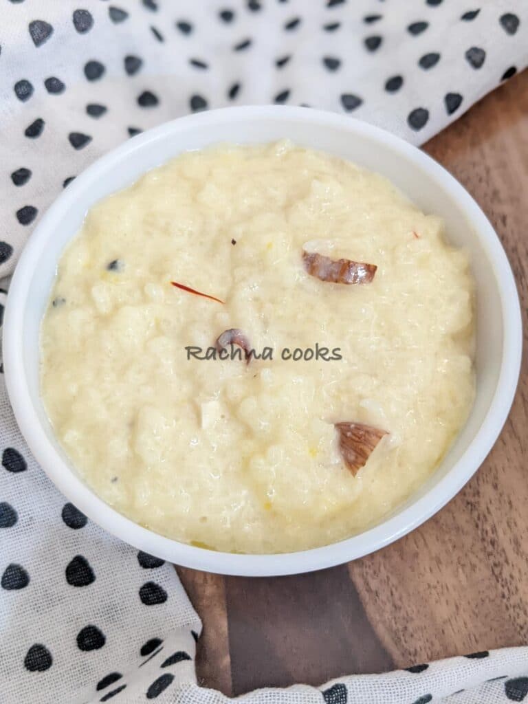 A bowl of rich kheer with slivers of almonds and saffron strands.