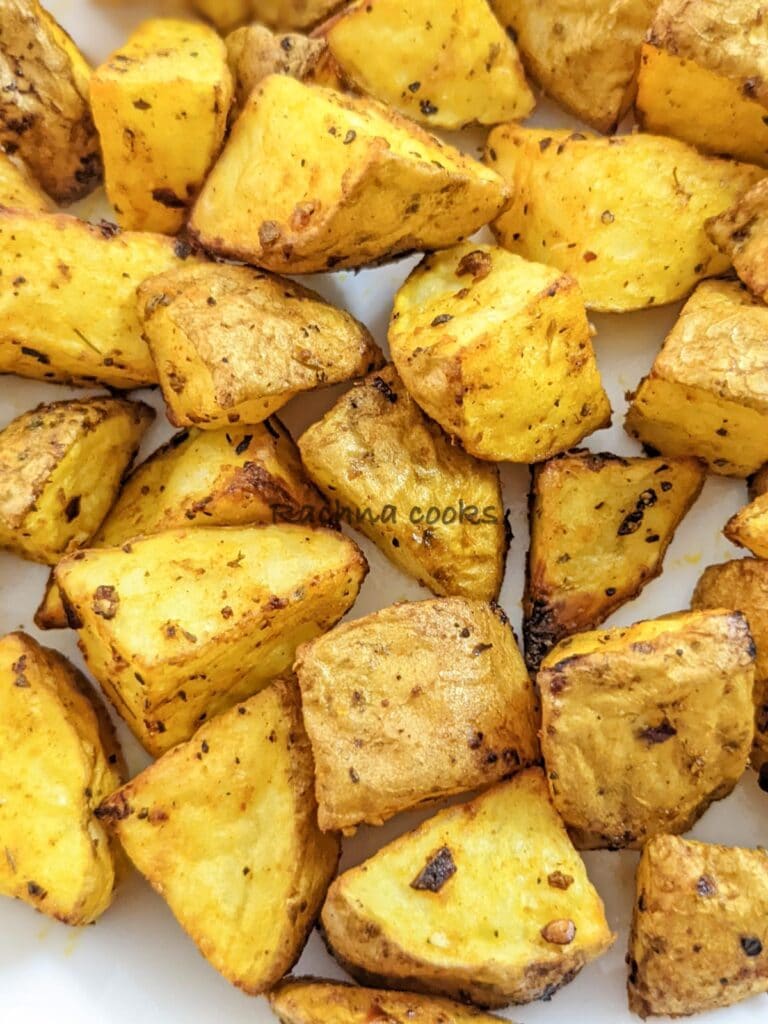 Close up of golden breakfast potato cubes after air frying.