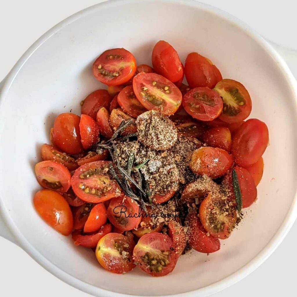 Halved cherry tomatoes with spices and olive oil
