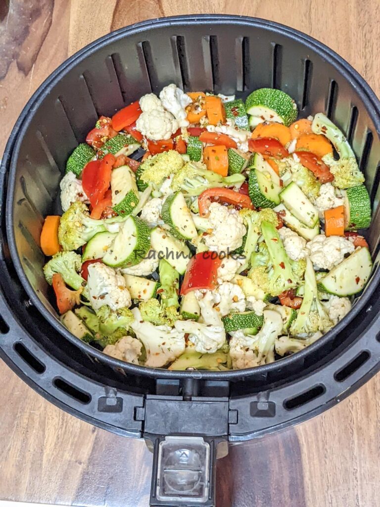 Vegetables in air fryer basket ready for air frying