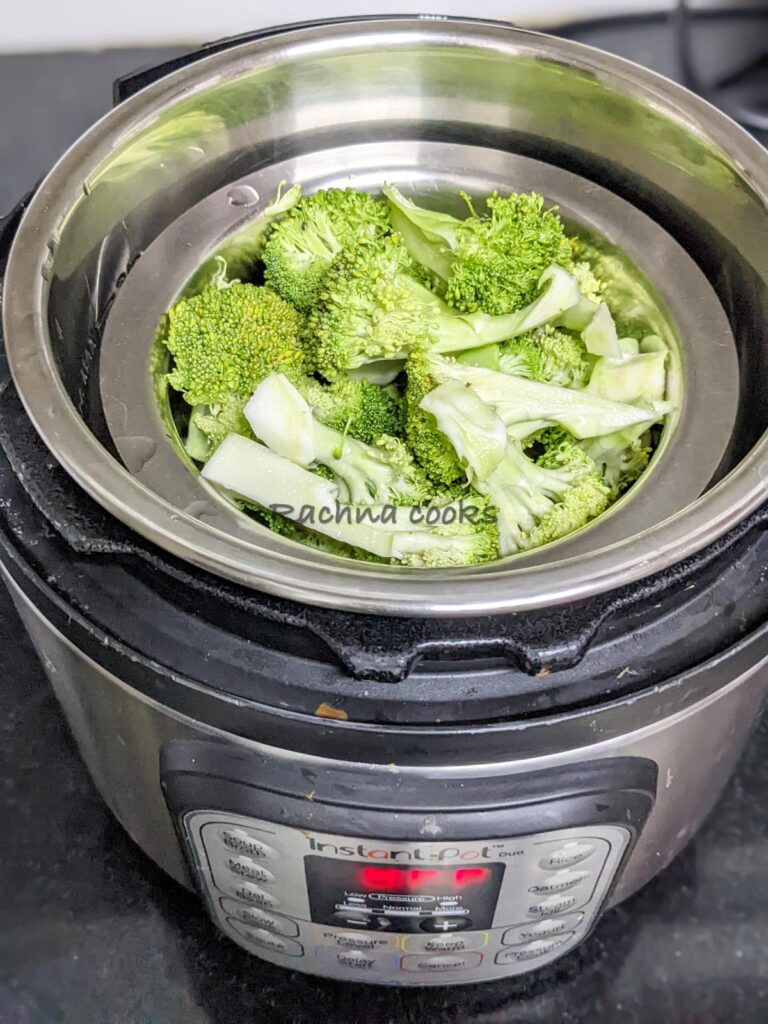 Broccoli kept in a steaming vessel in an instant pot.