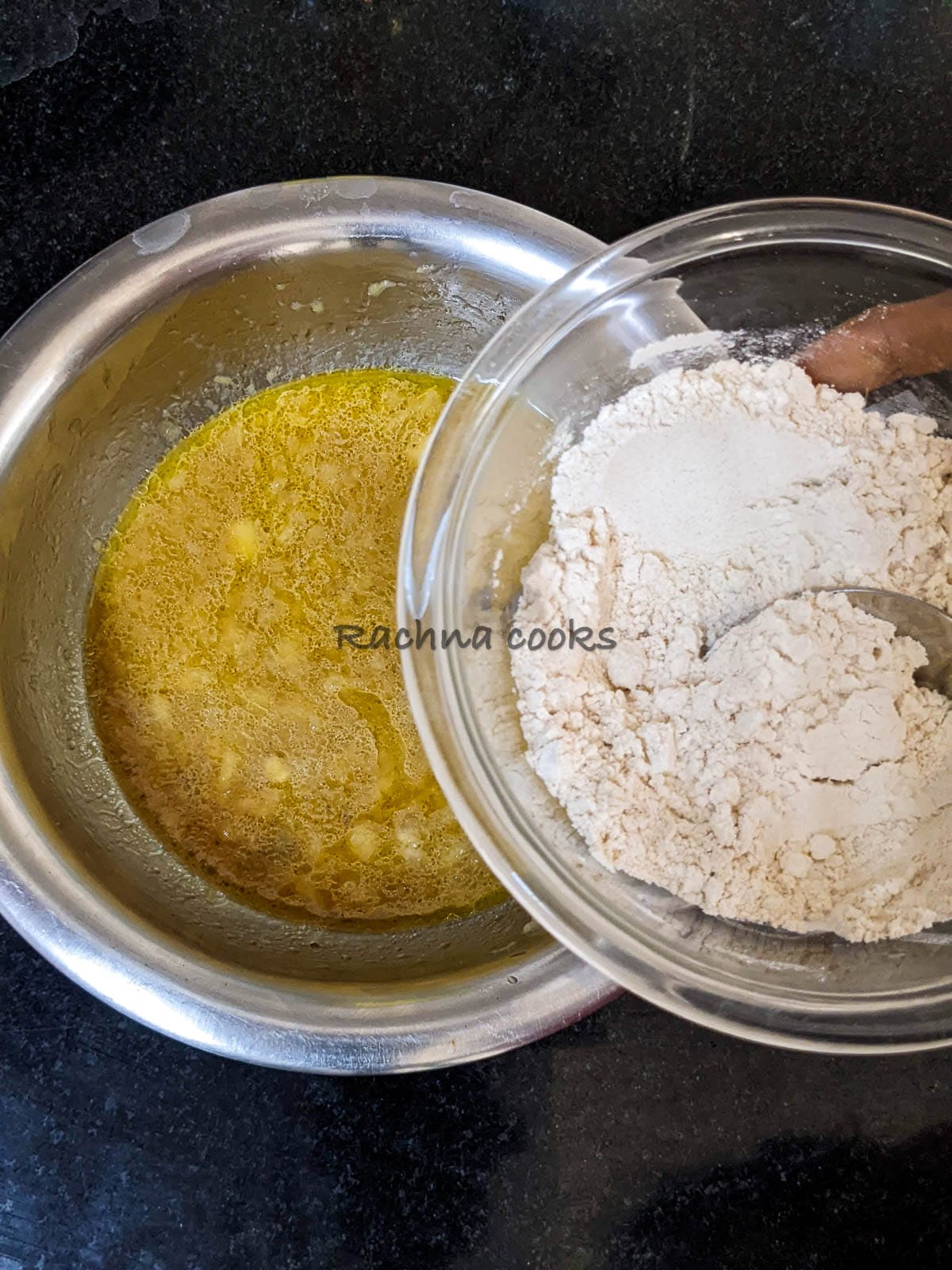 Flour and baking soda mix being added to the wet ingredients.