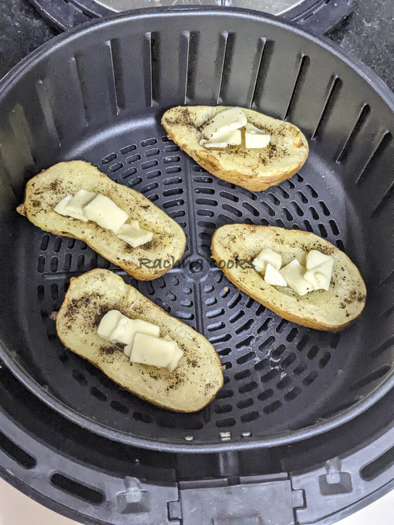 Potato boats after air frying filled with cheese.