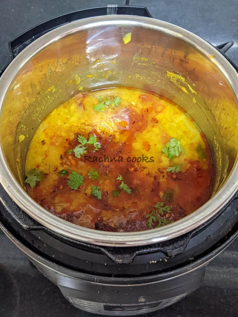 Dal tempered with ghee and spices in instant pot and garnished with cilantro