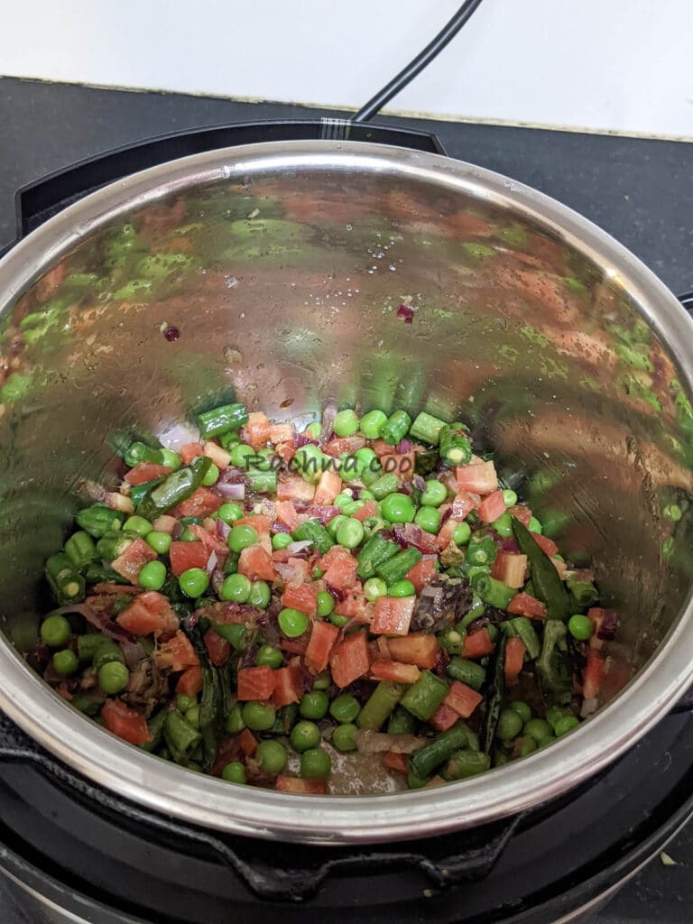 Vegetables being sauteed in instant pot.