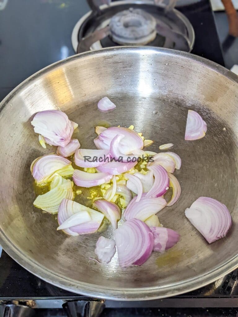 Frying sliced onion and minced garlic on a pan