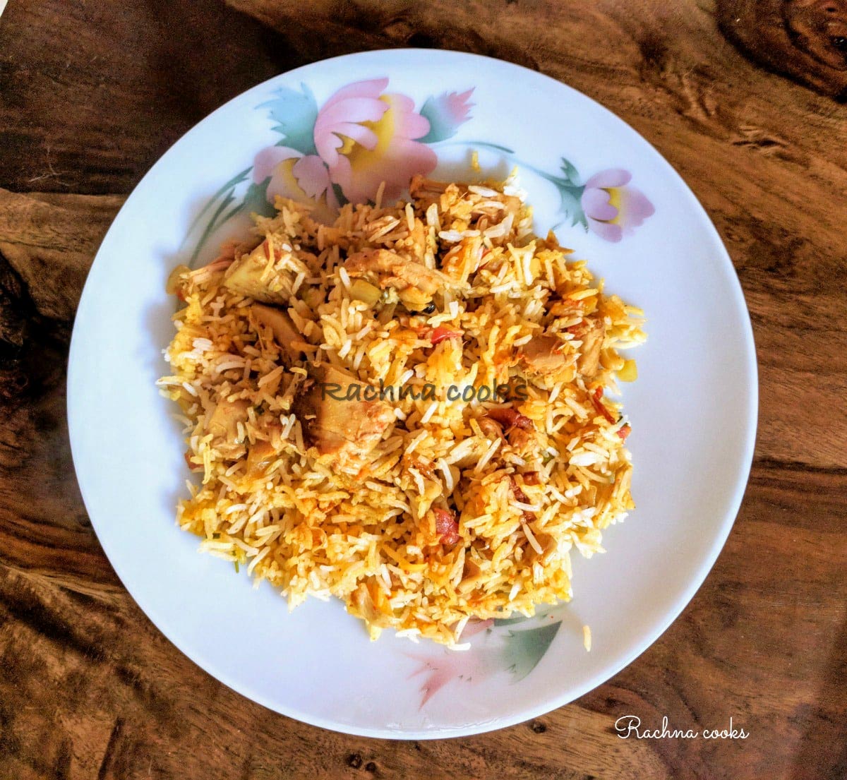 Delicious kathal biryani served on a white plate with a brown background