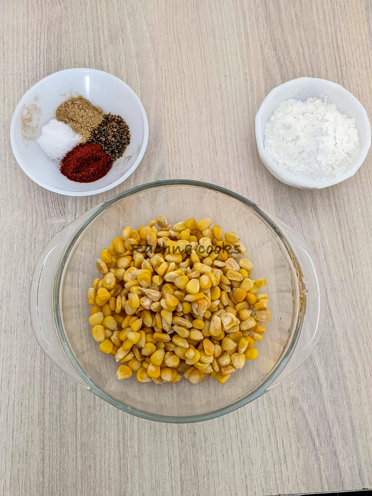 Corn, seasonings and cornstarch in 3 bowls