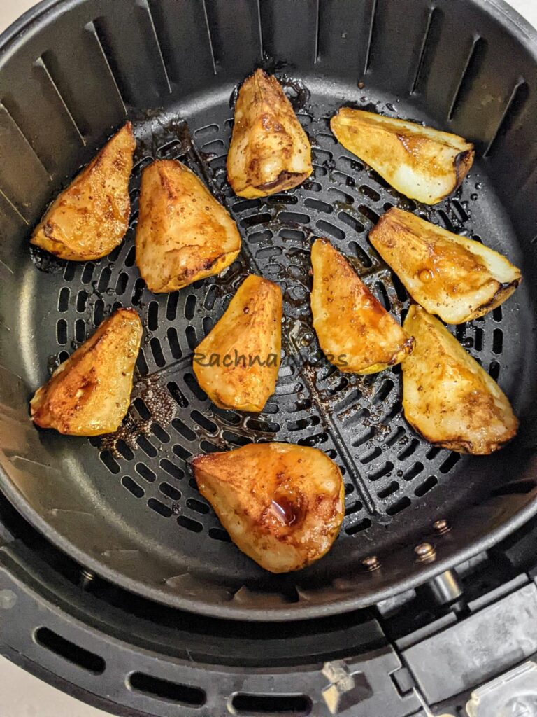 Caramelised pears after air frying in air fryer basket.