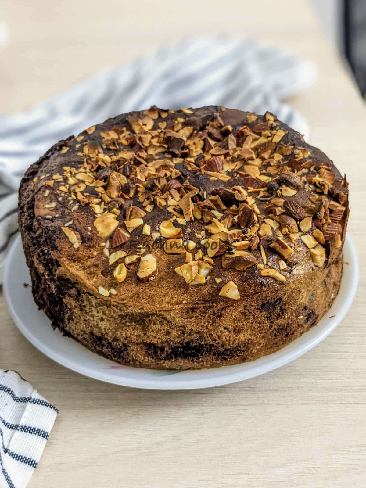 Delicious air fryer banana cake on a white plate.