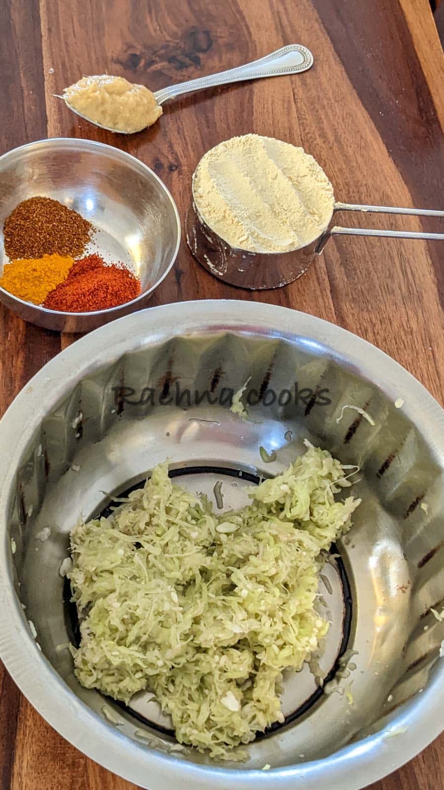 grated lauki in a bowl with spices in another bowl, chickpea flour and ginger garlic paste.