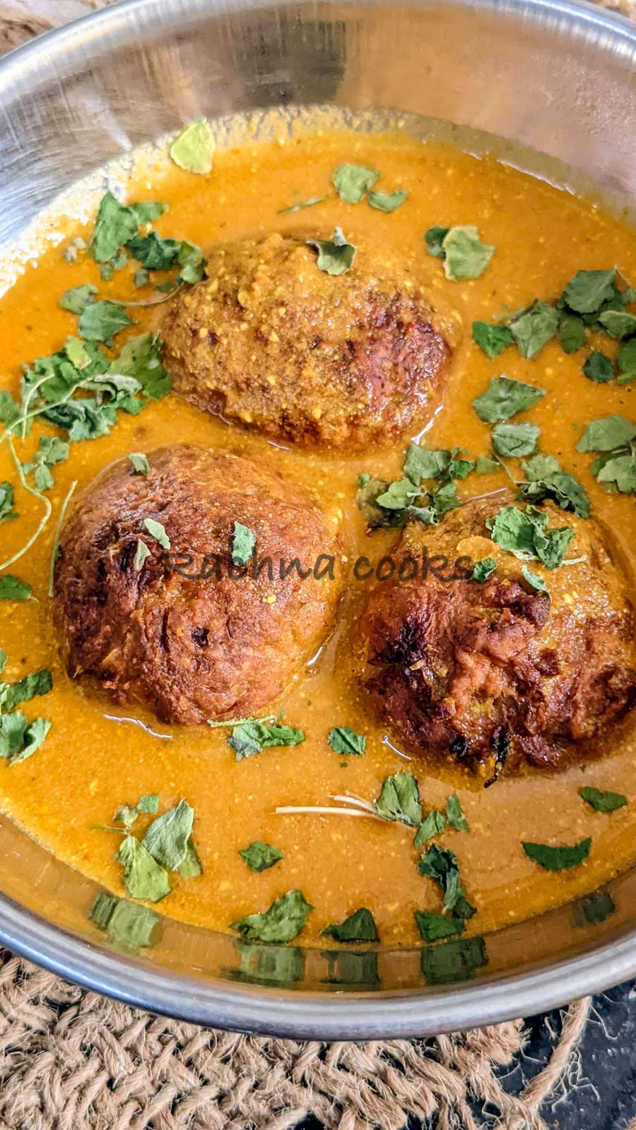 close up of Lauki kofta in curry served in a kadhai.