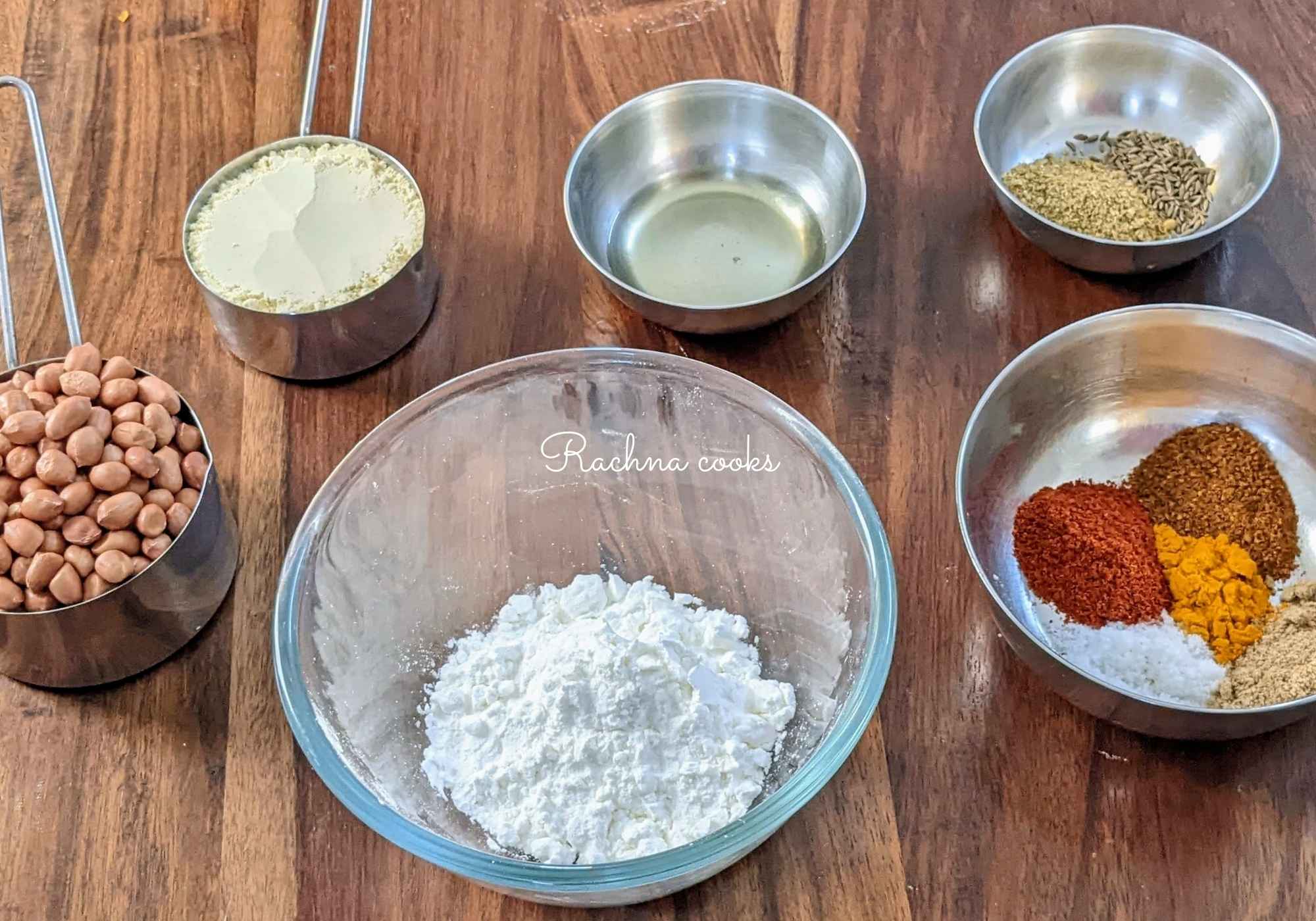 Ingredients for making masala peanuts in a bowl. 