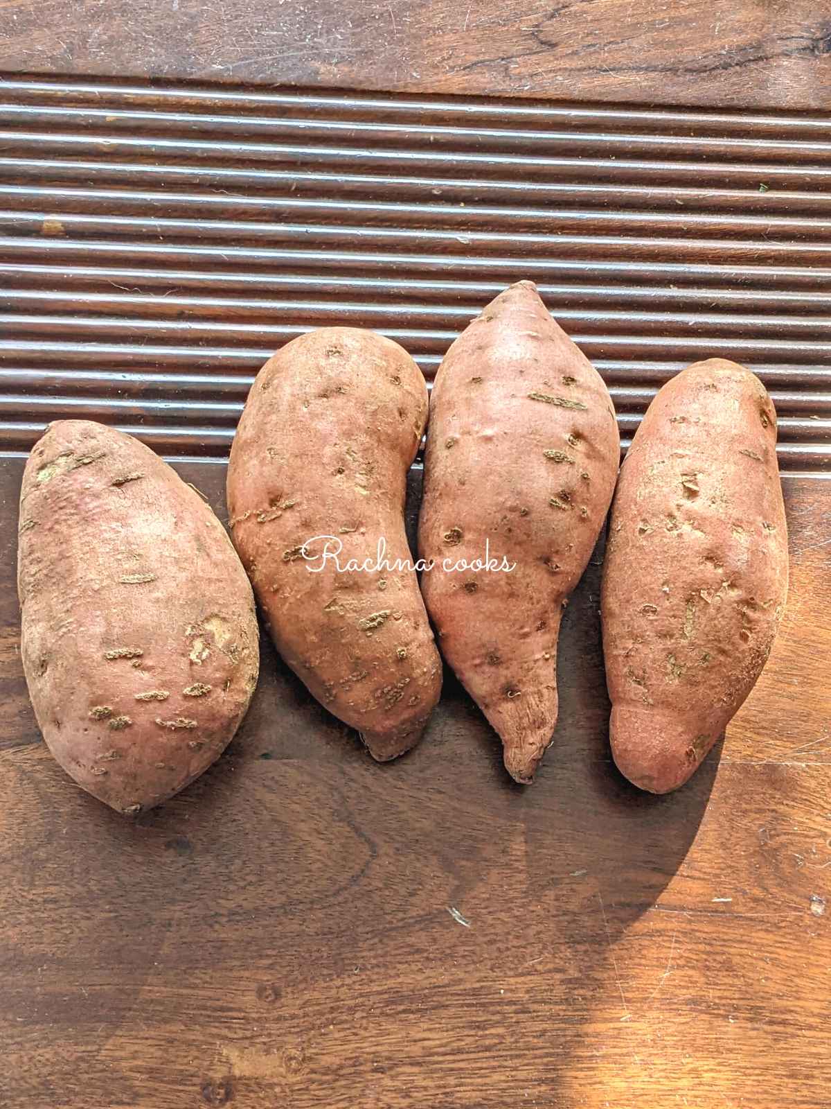 Raw sweet potatoes on a table