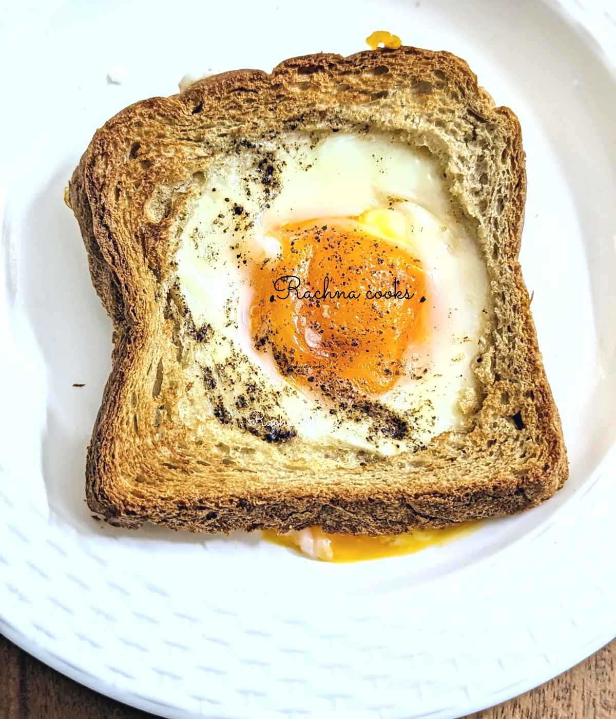 Egg toast on a white plate.