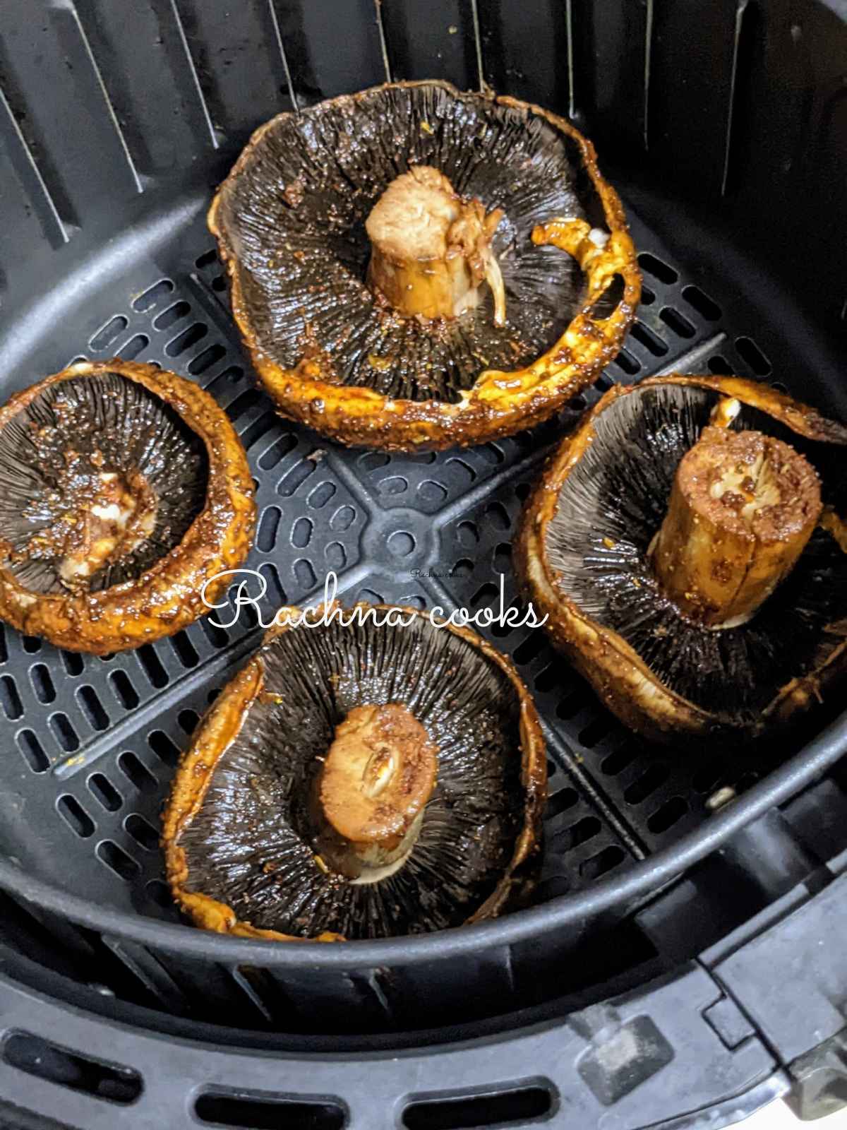 Marinated mushrooms placed in air fryer basket ready for air frying.
